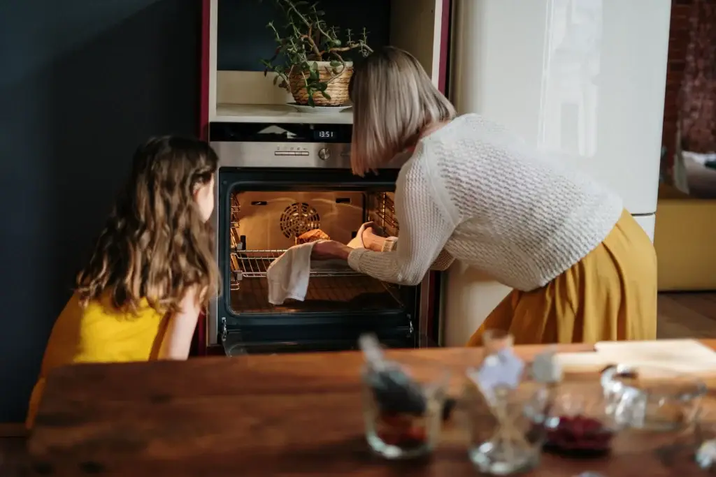 Appliance repair in Denver, Colorado technician fixing oven